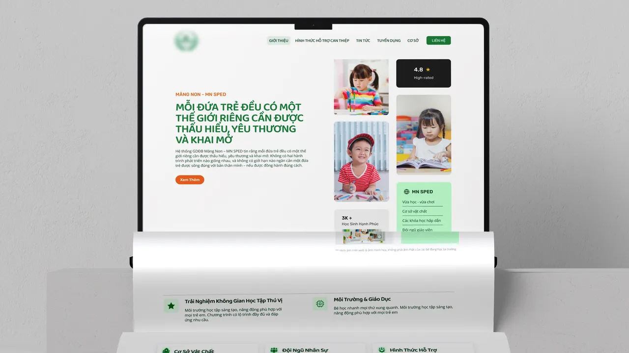 Preschool portal homepage on laptop mockup standing on a curved display stand
