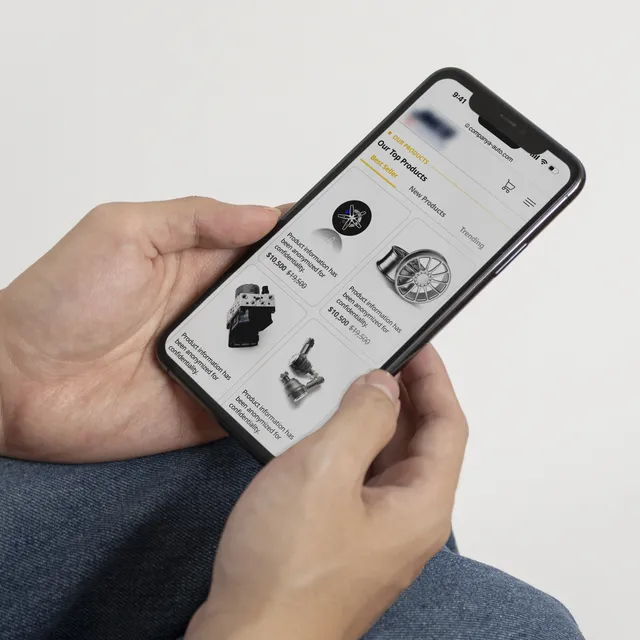 Hand holding mobile phone displaying catalog